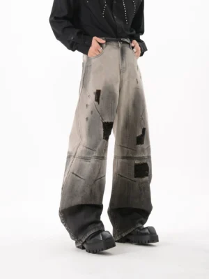 Ashfall distressed gradient wide leg jeans in black and grey wash styled with platform loafers front three-quarter view