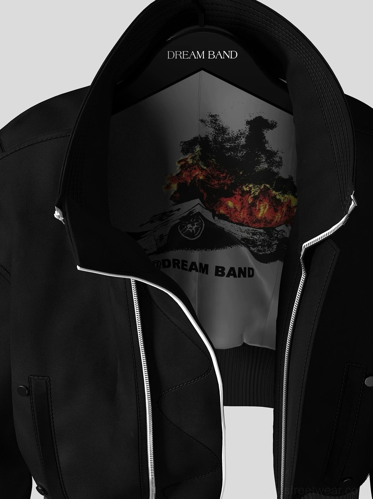 Close up of cropped bomber jacket inner collar and wildfire vehicle graphic lining with silver metal zipper detail