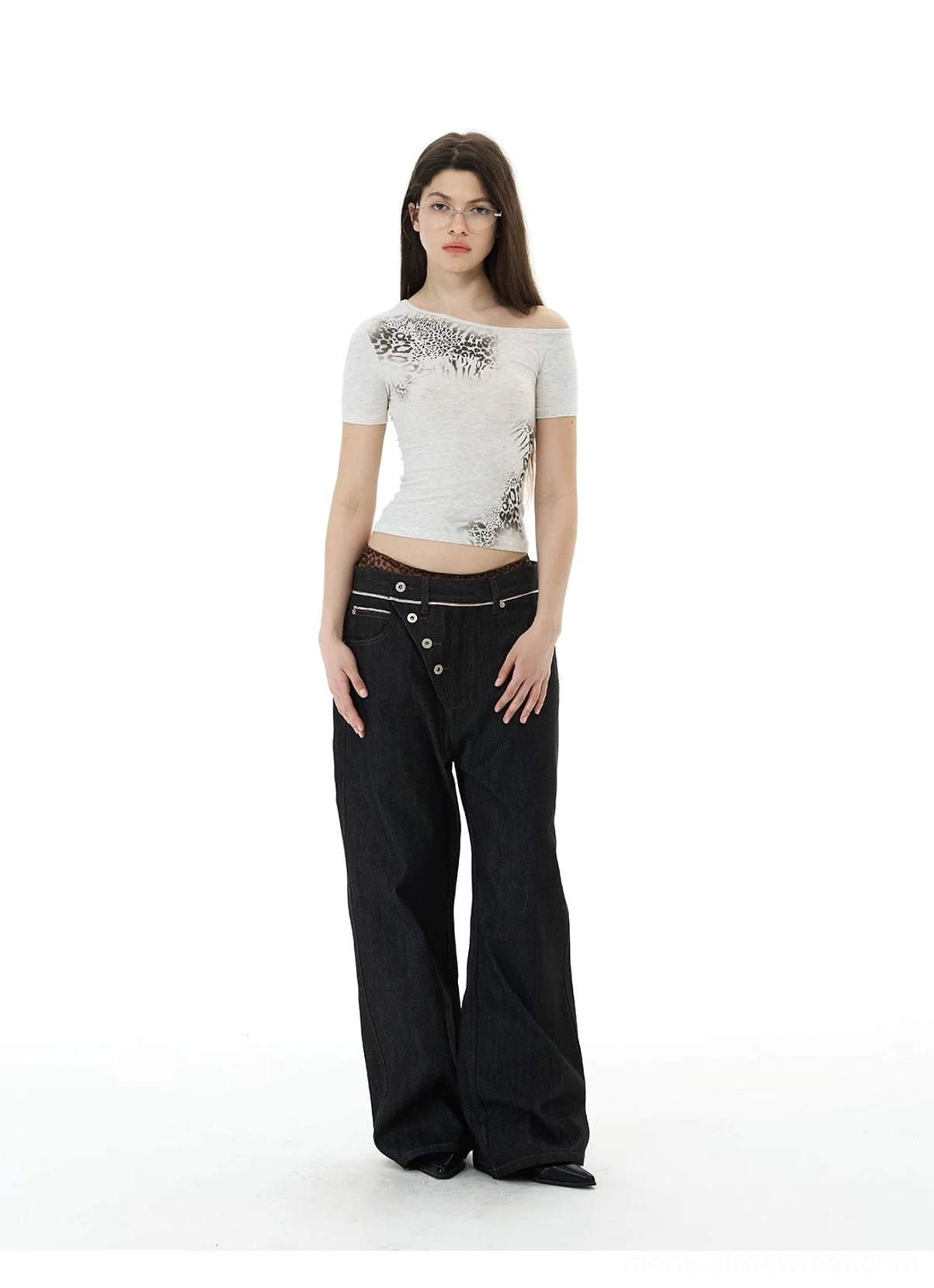 Full-body styling view of asymmetric button black wide-leg jeans with an off-shoulder top and loose streetwear fit