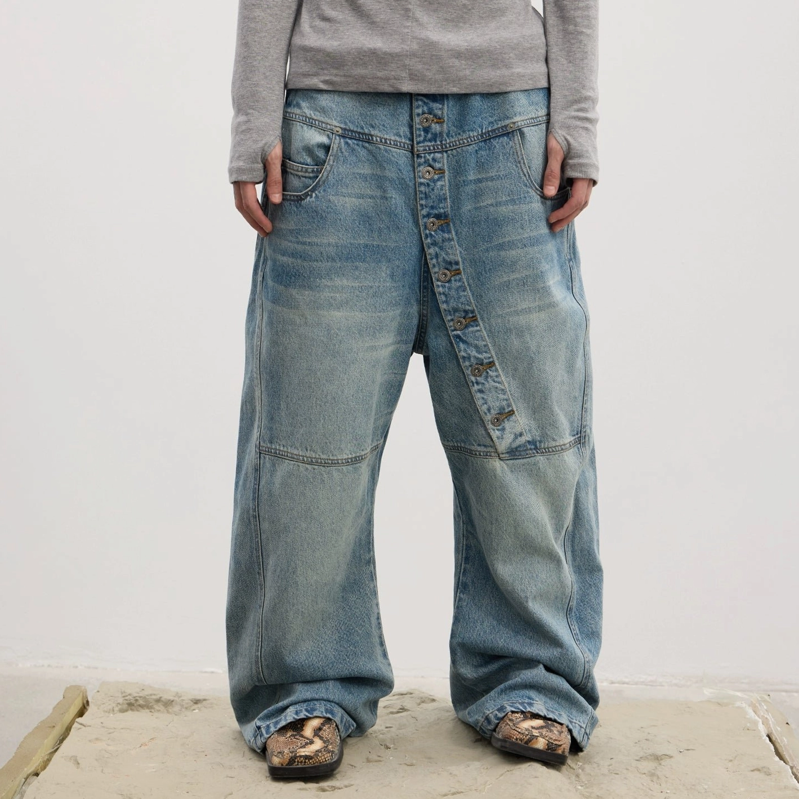 Asymmetric button fly wide-leg jeans in washed blue and black Korean streetwear denim style