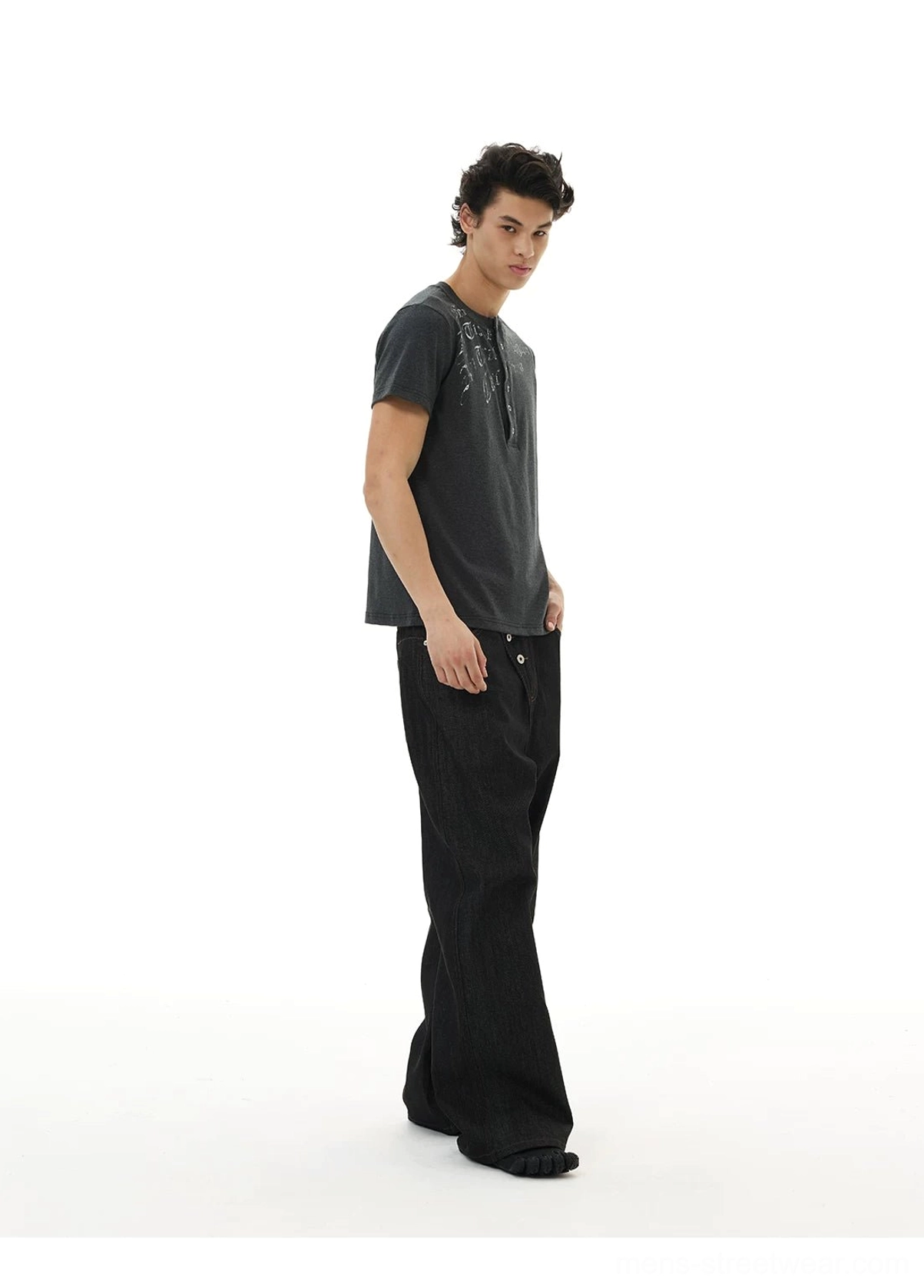 Asymmetric button wide-leg black jeans product image for Korean streetwear, avant-garde fashion, and oversized denim styling