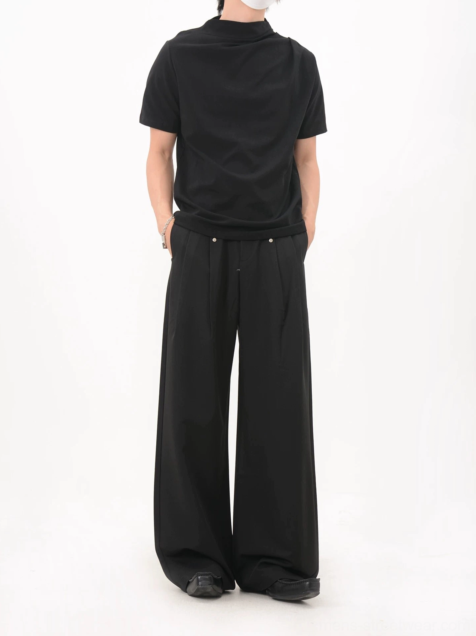 Black asymmetric drape collar jersey tee back full body view with clean minimalist rear design