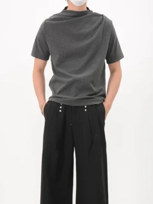 Black asymmetric drape collar jersey tee front full body view in minimalist streetwear styling