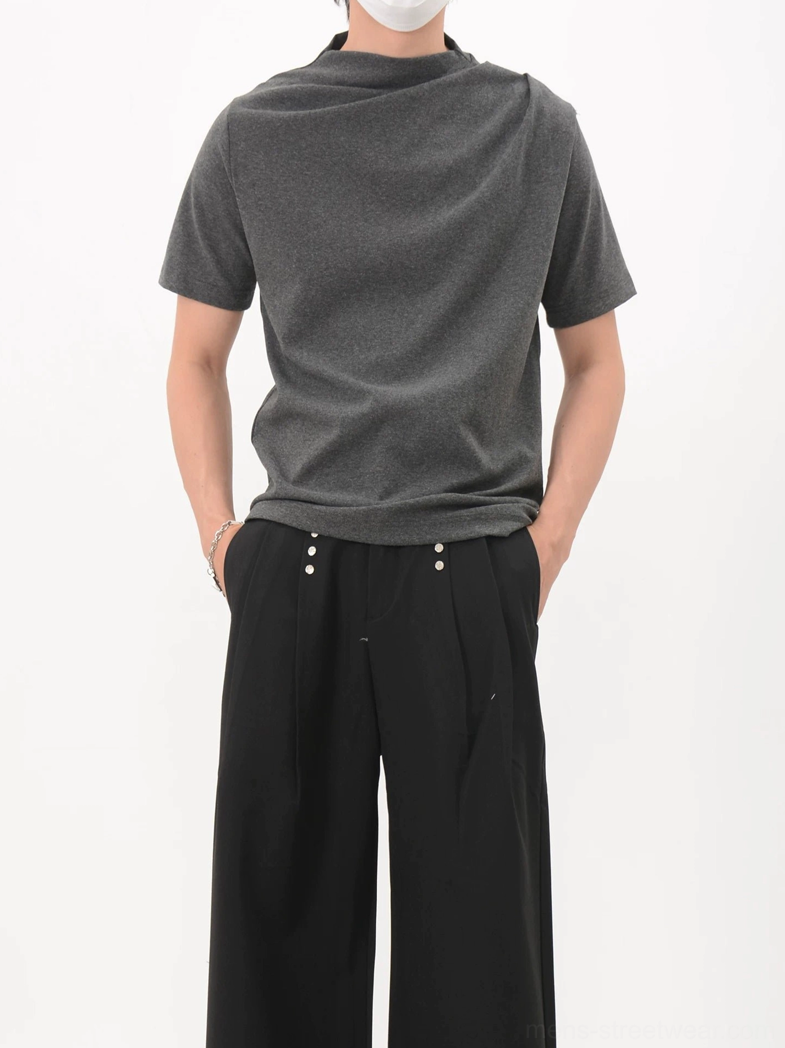 Black asymmetric drape collar jersey tee front full body view in minimalist streetwear styling