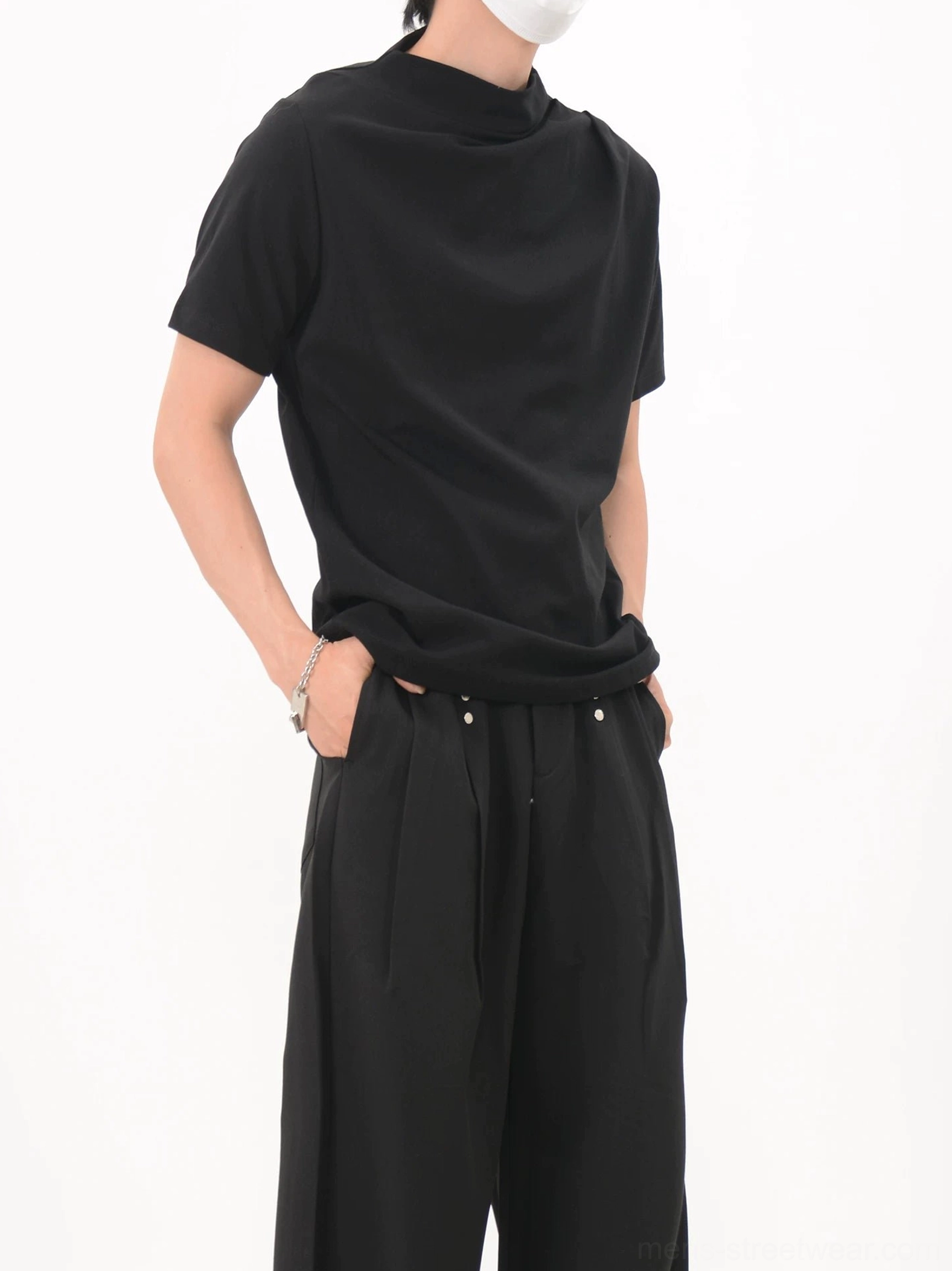 Black minimalist drape collar jersey tee three quarter view paired with wide leg streetwear trousers