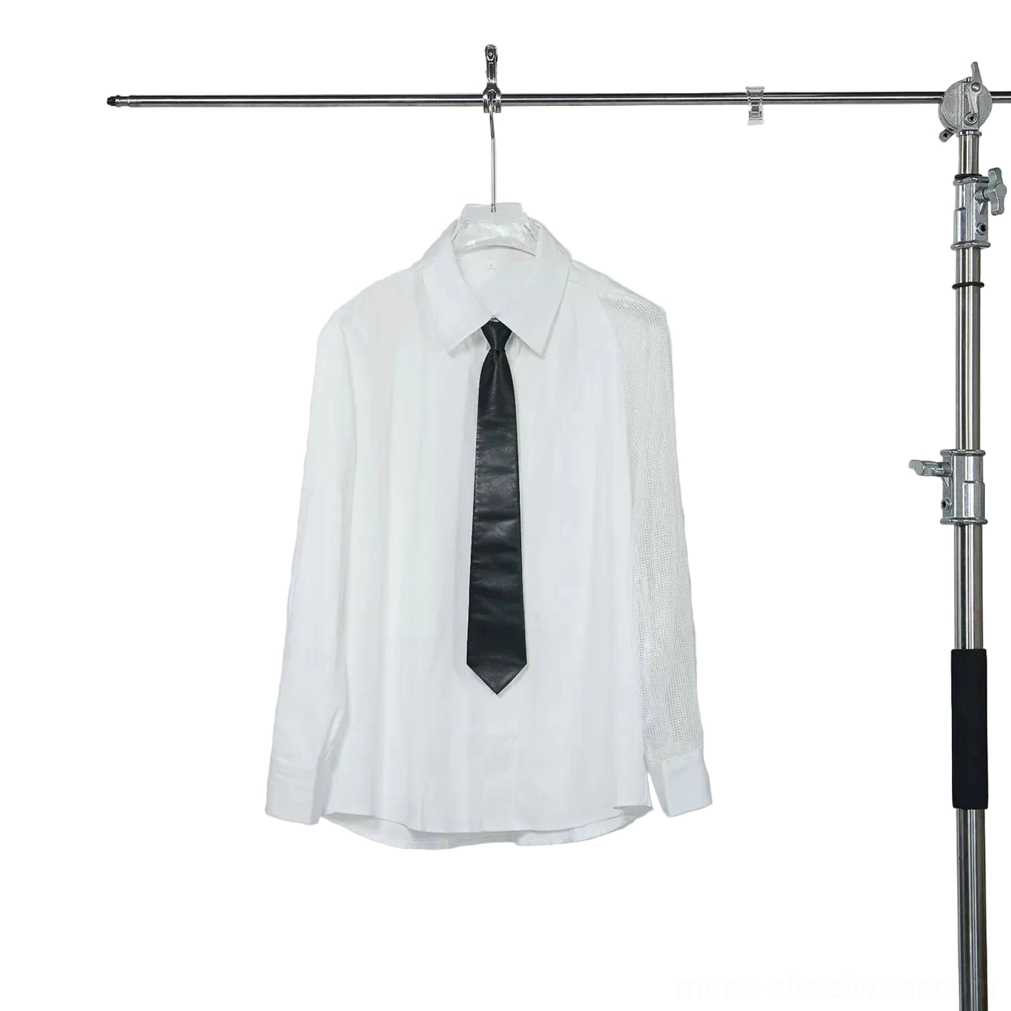 White asymmetric mesh sleeve long sleeve dress shirt with pointed collar curved hem and matching black tie on hanger