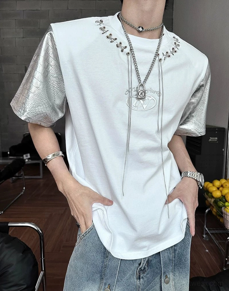 Avant-garde East Asian fashion T-shirt featuring contrasting cotton body, statement faux-leather sleeves, and industrial chain detailing