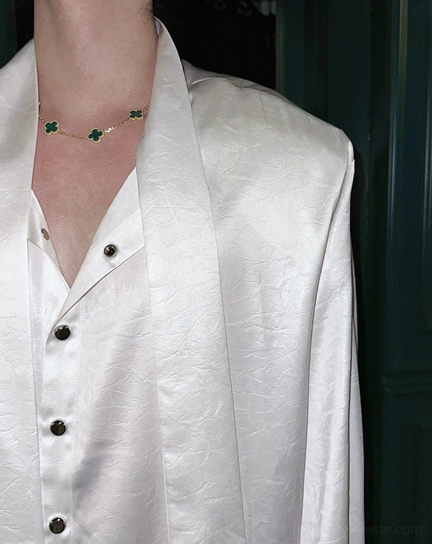 Avant-garde glossy tie-neck shirt with long sleeves, relaxed fit, and statement neck styling