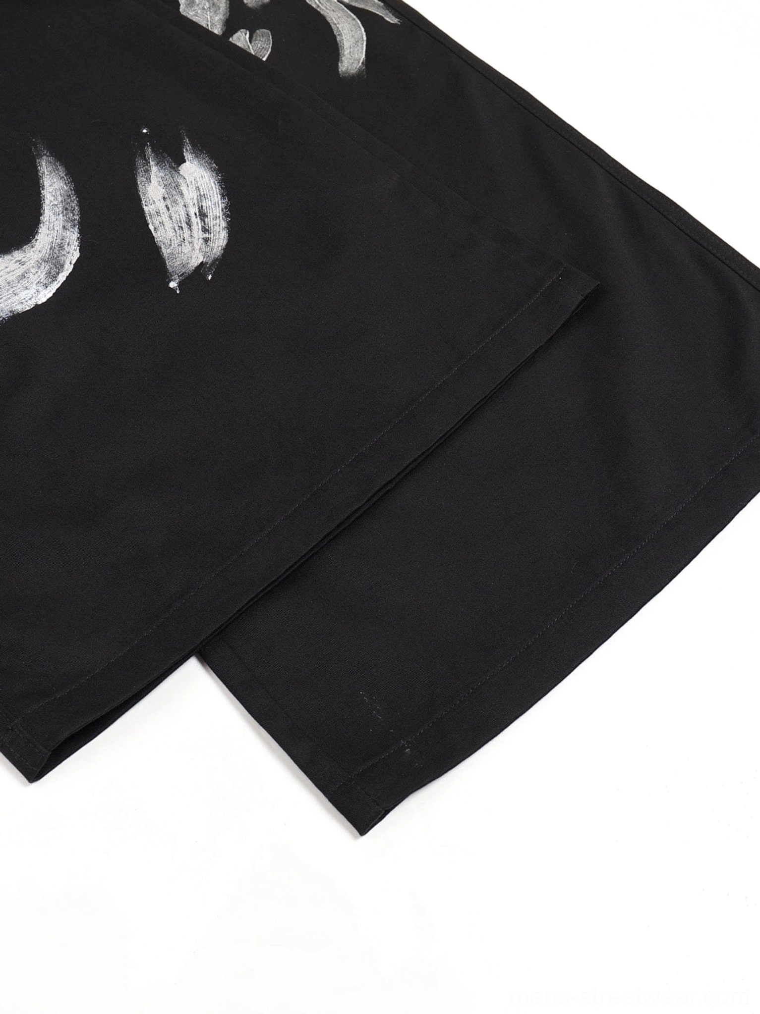 Avant-garde metallic strap cargo pants product image featuring black utility construction and oversized streetwear proportions