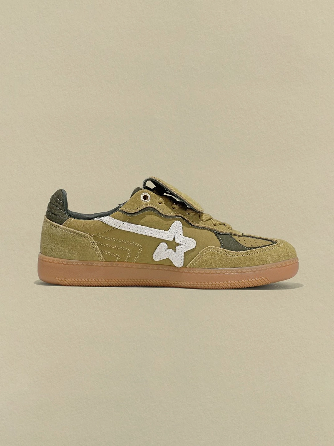 Avocado suede star-panel retro sneakers in an alternate left-side product view highlighting the dark green heel and layered side details