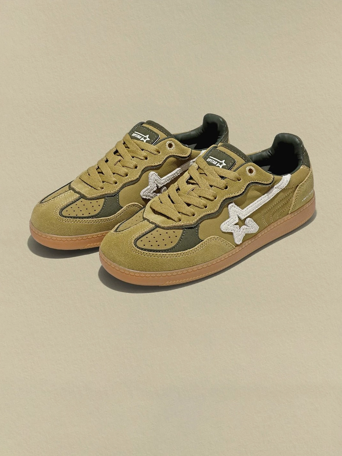 Avocado suede star-panel retro sneakers product image with layered olive upper, contrasting dark green accents, and classic gum rubber sole