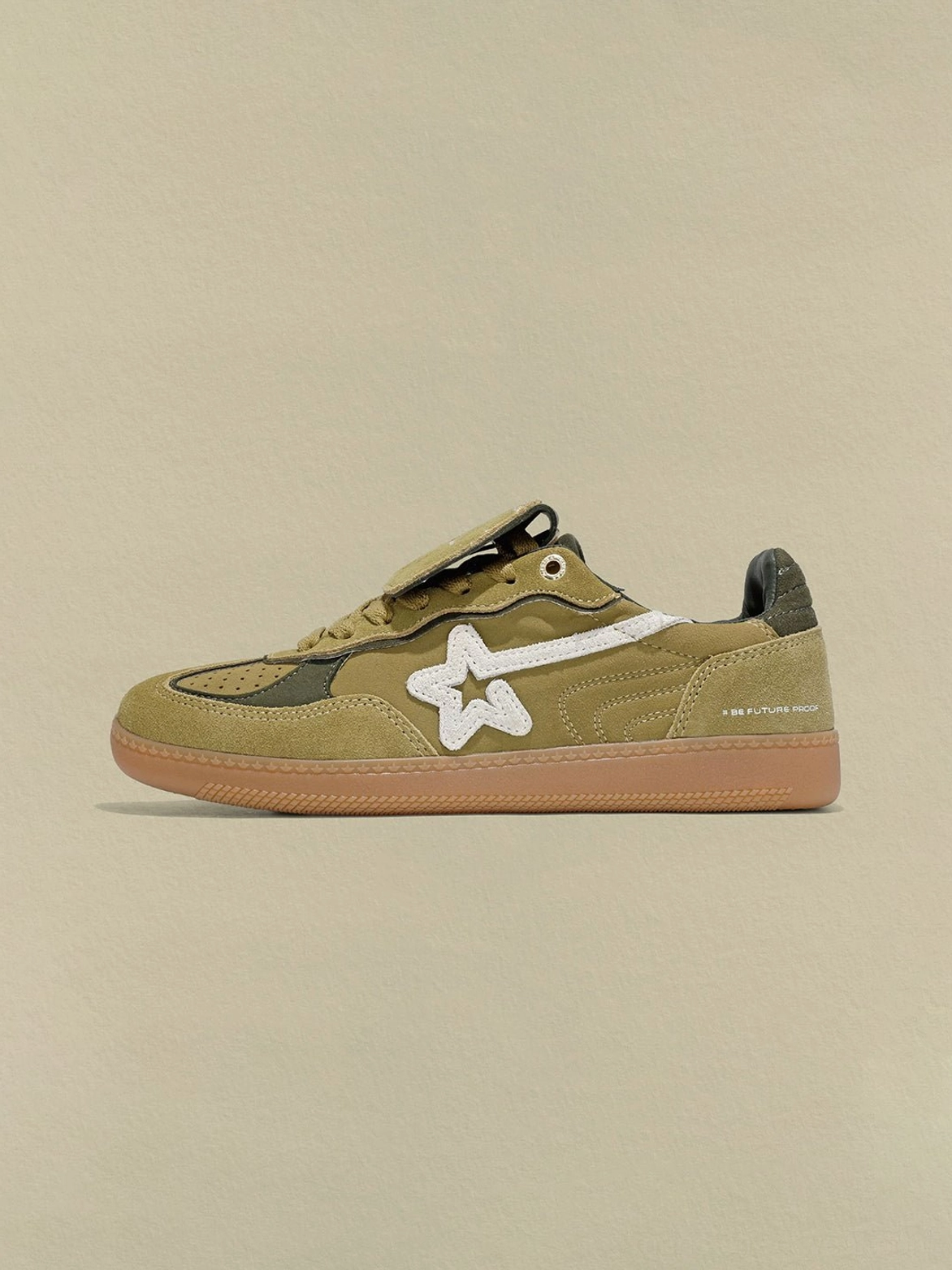 Avocado suede star-panel retro sneakers shown from the right side with dark green heel counter and contrasting side star stripe