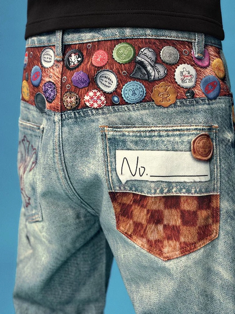 Rear close up of acid wash wide leg denim jeans showing badge waistband checked pocket and contrast patch details