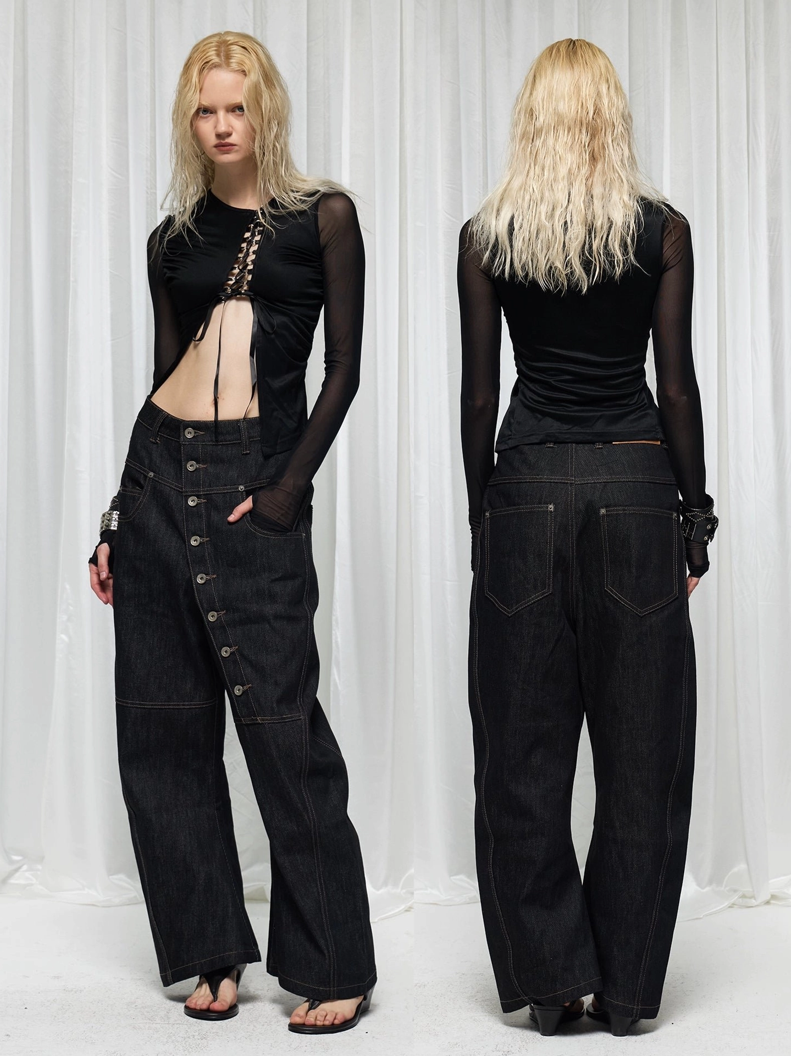 Front and rear view of baggy drop crotch asymmetric wide-leg jeans styled with a chain waist accessory
