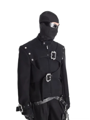 Baroque buckle harness cropped black faux leather moto jacket worn by model in left three quarter front view with silver hardware