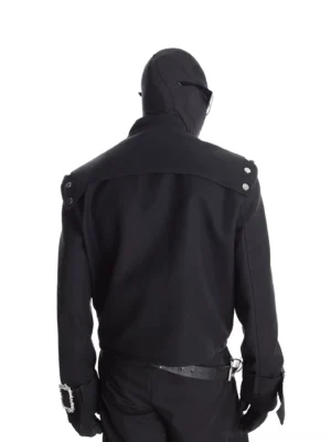 Rear view of black cropped harness moto jacket showing structured back panel shoulder snaps adjustable cuff buckles and waist belt detail