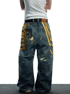 Rear view of dark vintage washed baroque military embroidered wide-leg jeans showing gold back embroidery and pocket charm detail