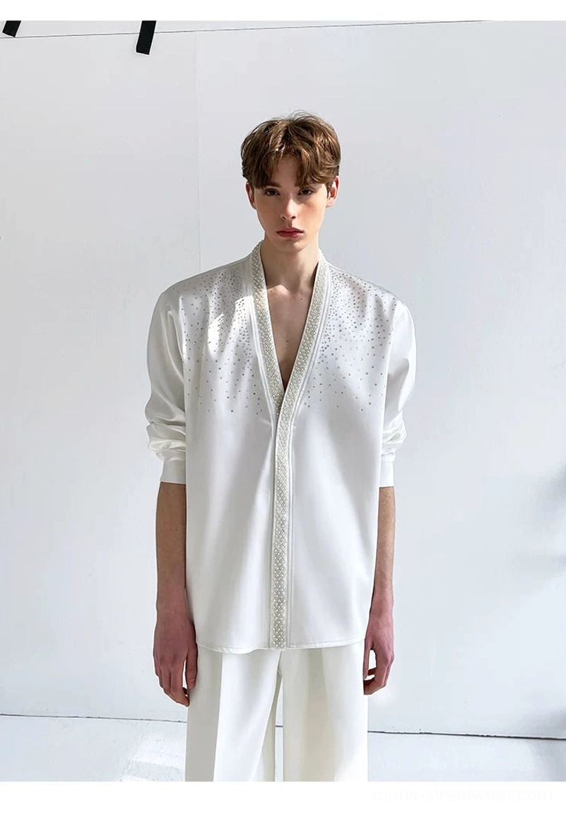Front view of a basic ivory satin men's shirt with a clean deep V-neck, loose relaxed silhouette, and minimalist white monochrome styling