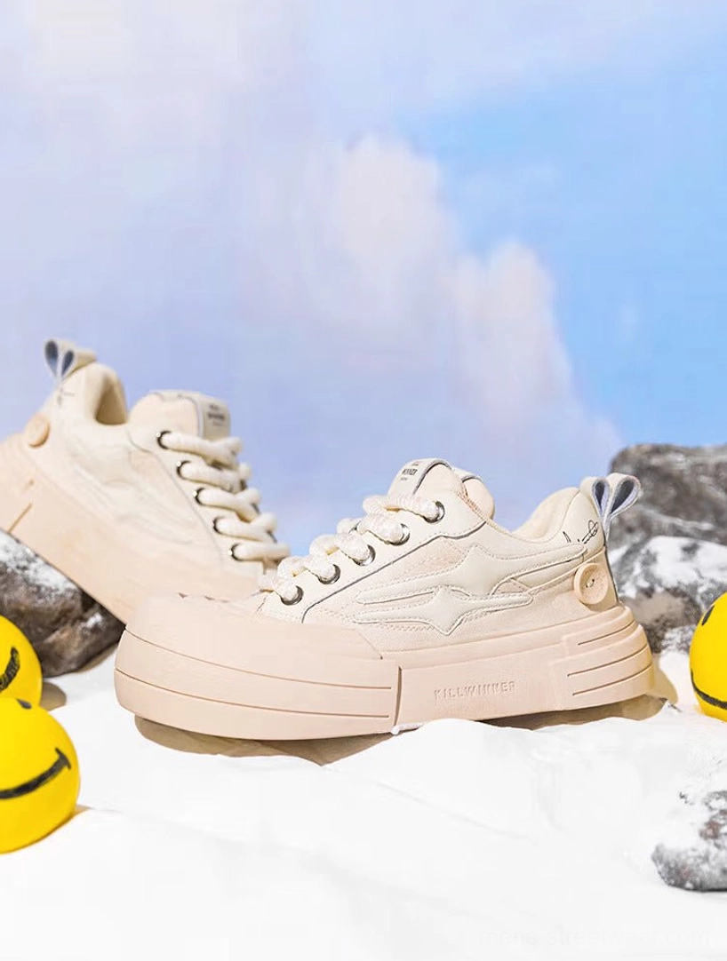 Pair of beige platform sneakers viewed from the rear side with smooth textile uppers, graphic heel panels, and thick sculpted rubber midsoles