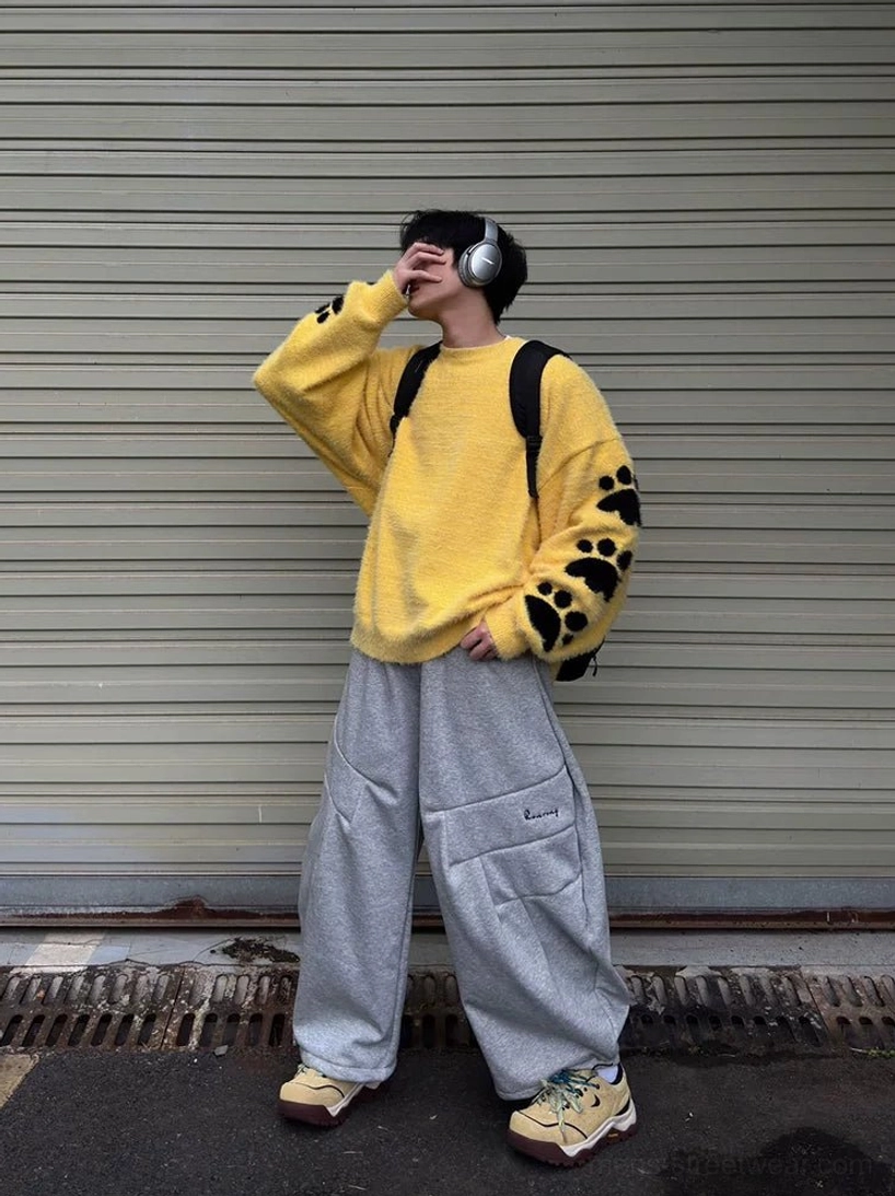Beige Terrain Crest chunky trail sneakers worn with cargo pants in a modern Korean streetwear outfit against an urban roller shutter background