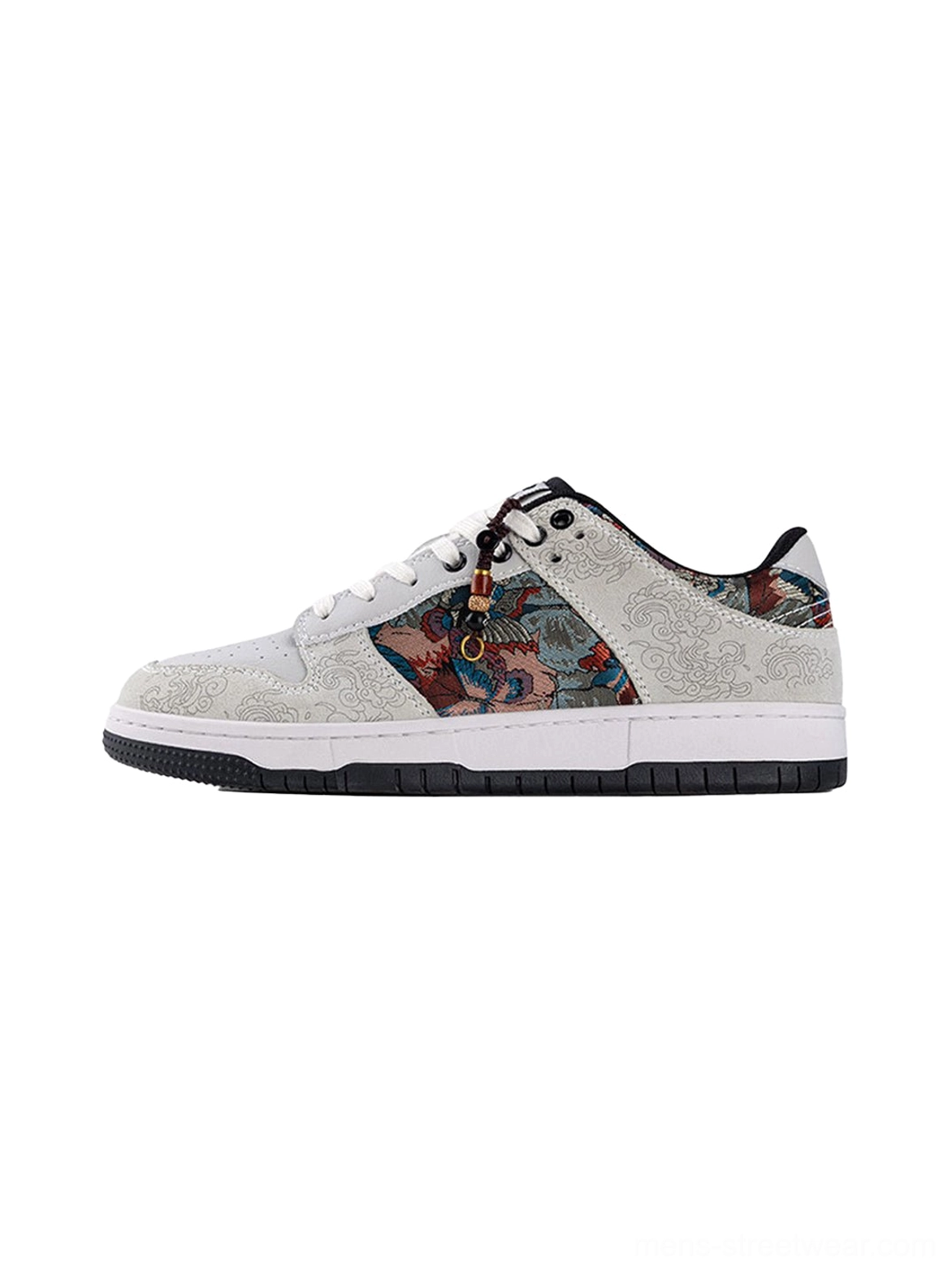 White bird embroidered brocade court sneaker shown in a front three-quarter product view with textured upper and black rubber outsole