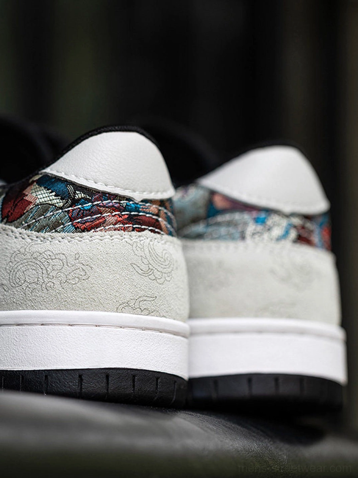 White embroidered bird court sneakers designed with textured mixed-material upper and flat rubber outsole