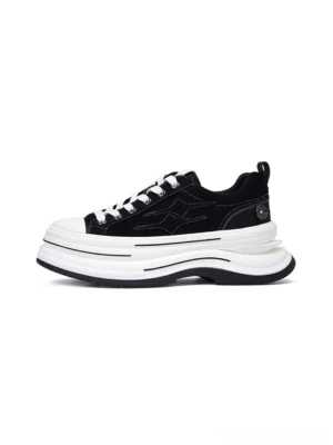 Black 7cm layered platform canvas sneaker shown from the left side with white stacked sole, star stitching, white laces, and metal heel buckle