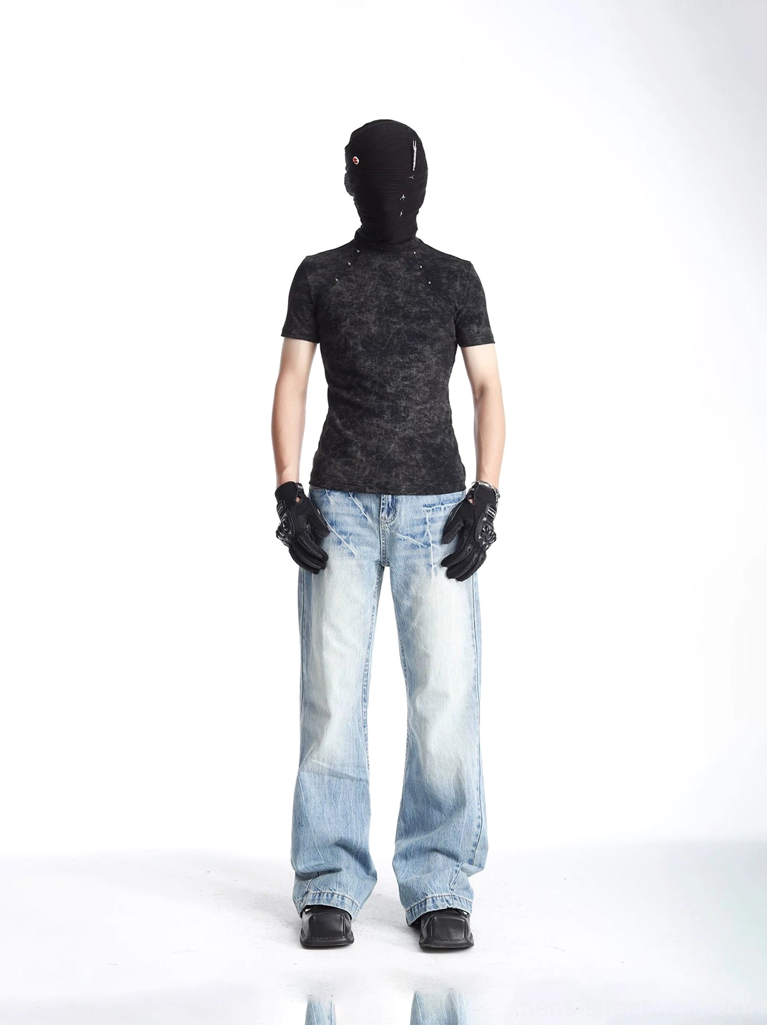 Full front view of a black acid washed slim fit T-shirt with subtle metal rivet shoulder details and light denim styling