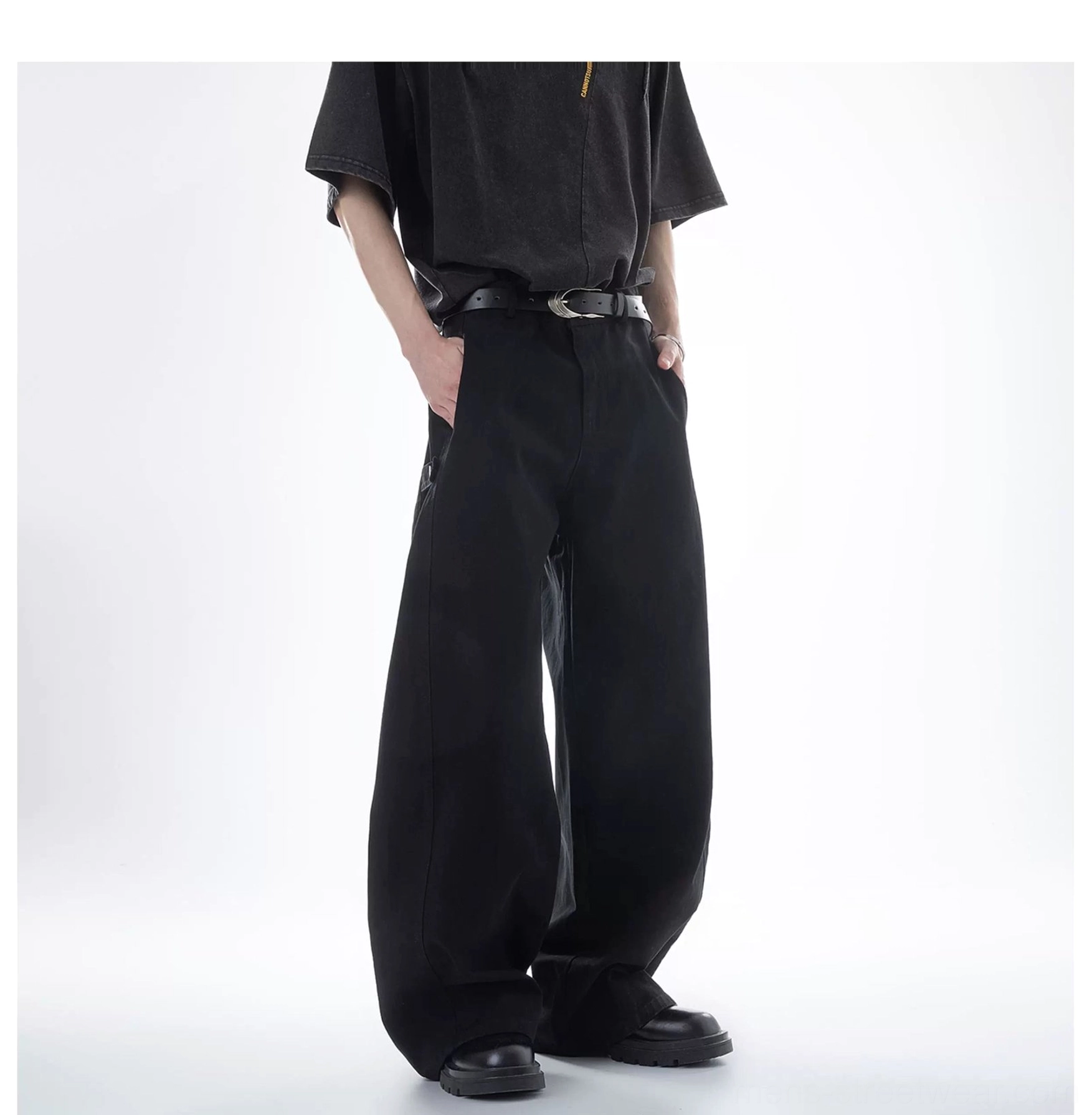 Black Acubi ultra wide-leg cargo pants shown from a side-rear full-body angle with a high waist, relaxed fit, oversized legs, and casual Korean streetwear styling
