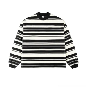 Black and apricot Breton stripe long sleeve crew neck tee displayed from the front with a relaxed oversized silhouette