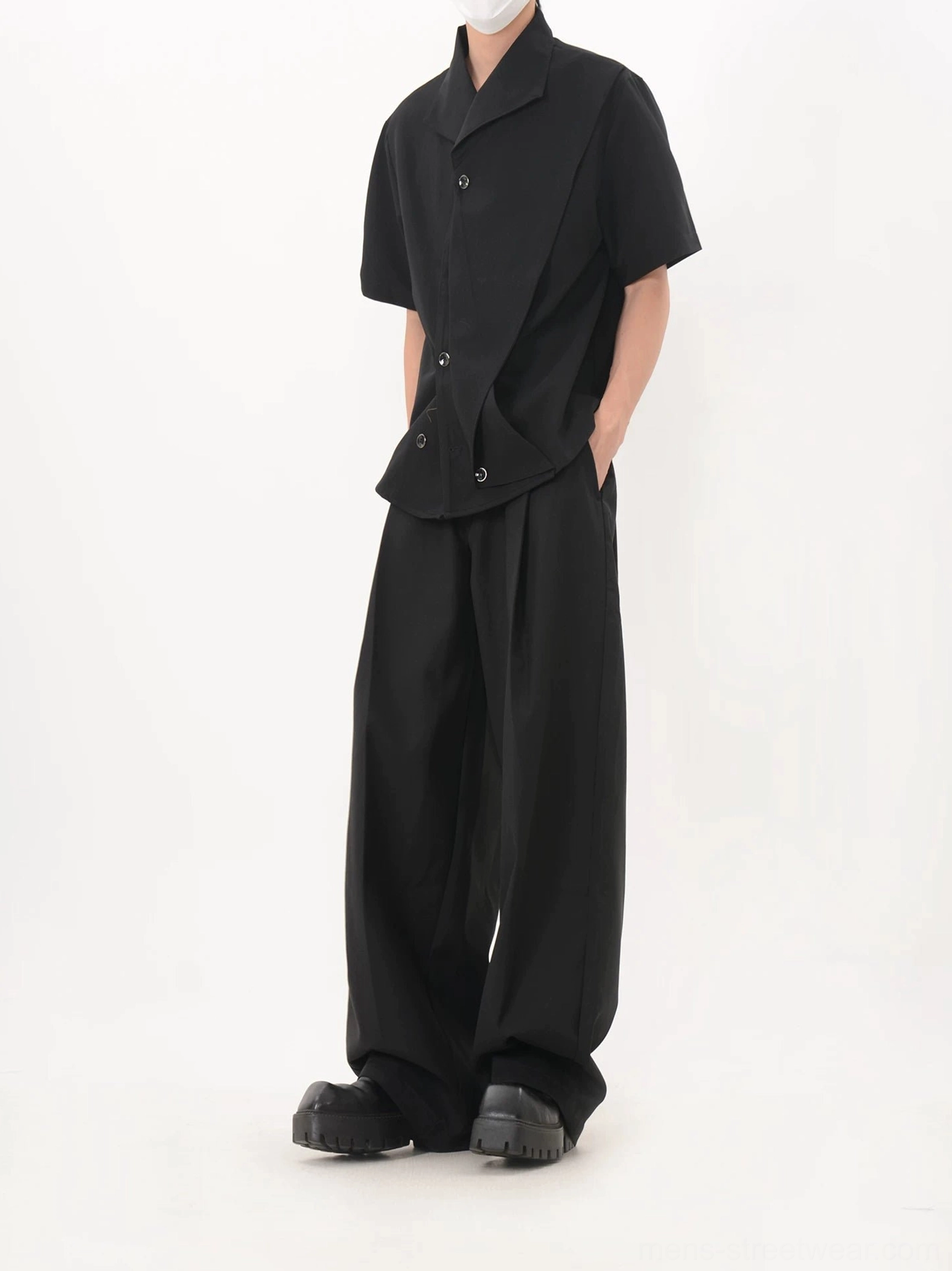 Black asymmetric cascade button shirt left side view with relaxed tailored wide leg trousers