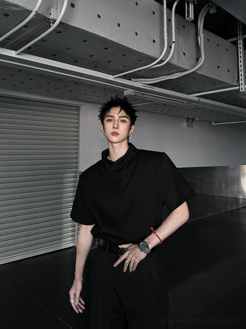 Black asymmetric collar T-shirt styled with tailored trousers, modern Seoul citywear silhouette, and understated techwear influence