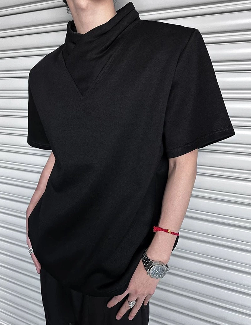 Front detail of black asymmetric folded collar T-shirt with matte cotton finish, relaxed fit, and modern Seoul streetwear styling