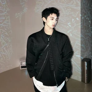 Black asymmetric zip perforated techwear jacket worn in a front three-quarter view with a relaxed boxy Korean streetwear fit