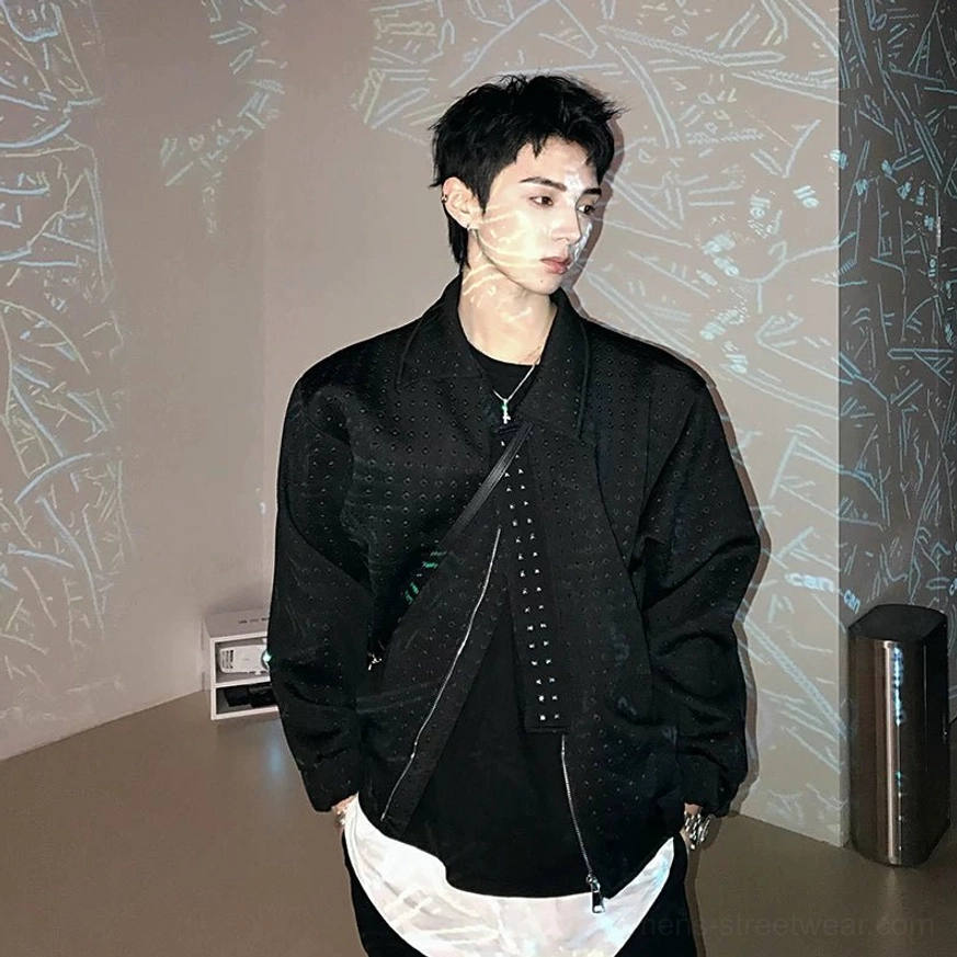 Black asymmetric zip perforated techwear jacket worn in a front three-quarter view with a relaxed boxy Korean streetwear fit
