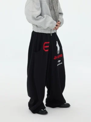 Black Atlanta graphic hyper volume baggy sweatpants front three quarter view with red number print and equestrian artwork