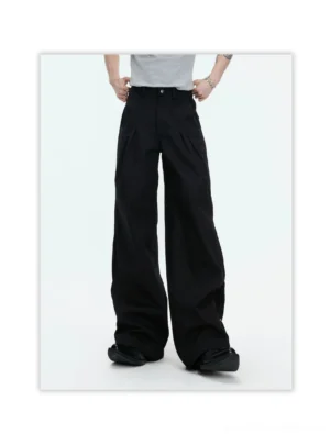 Black avant-garde draped wide leg pants front view featuring a high waist, tailored front pleats, and relaxed flowing legs