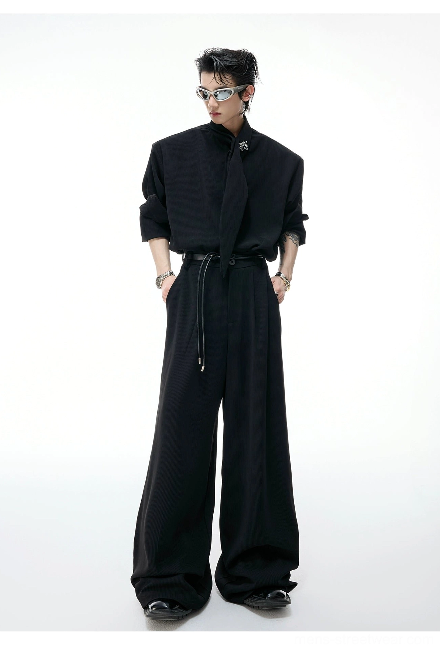 Black avant-garde scarf collar wide-leg suit with asymmetrical knotted neckline, relaxed tailored fit, and matching drawstring waist trousers