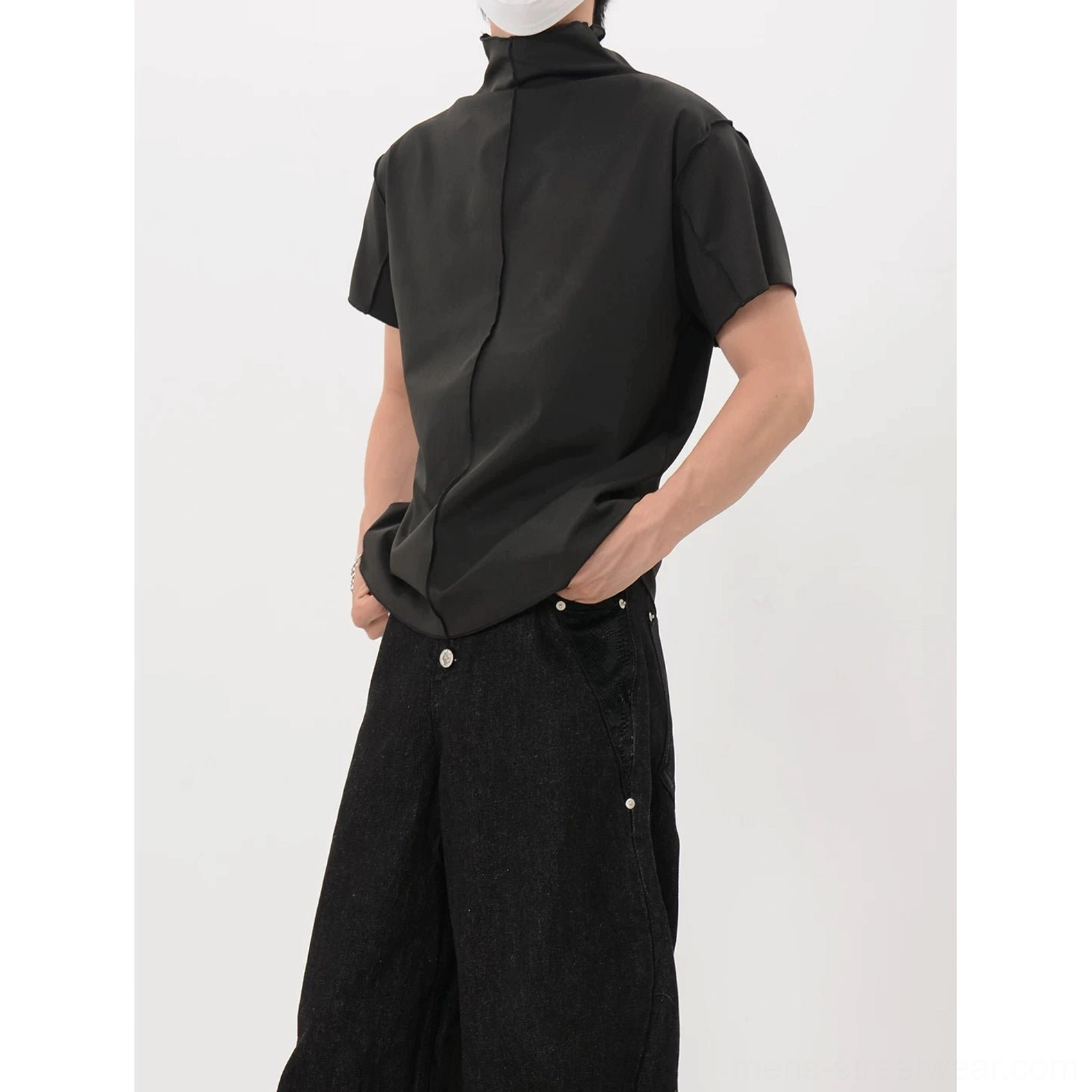 Black back seam mock neck shirt with relaxed fit, curved hem, and refined minimalist streetwear styling