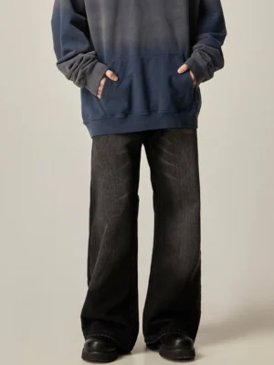 Full front view of relaxed black baggy jeans with classic waistband and wide straight-leg Korean streetwear fit