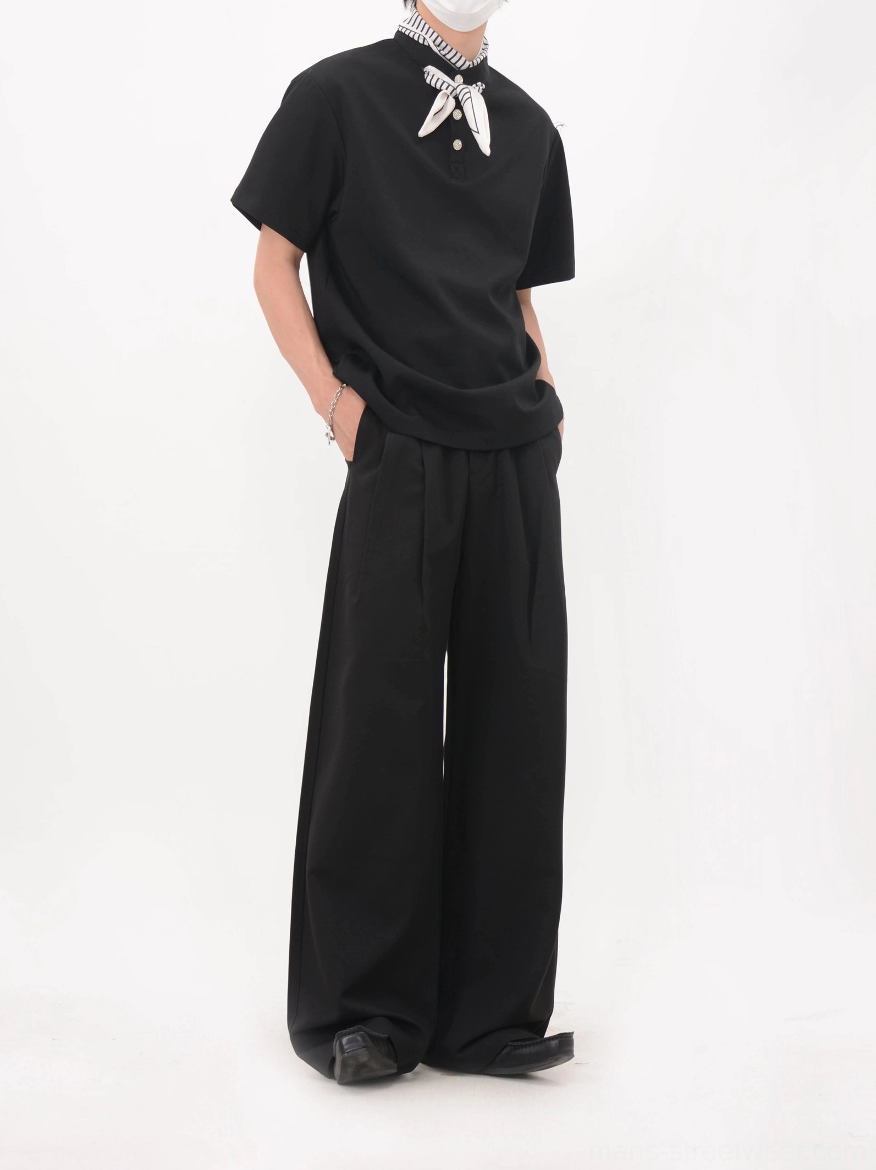 Black bandana collar polo tee shown from the rear side with a relaxed dropped-shoulder fit and casual streetwear proportions