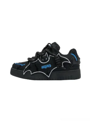 Black bat wing platform sneakers with blue contrast trim, white outlined bat graphic, embroidered details, chunky rubber sole, and low top skate silhouette
