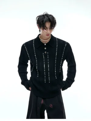 Black beaded rib knit polo sweater full front view with long sleeves, vertical pearl-like trim, polo collar and relaxed streetwear fit