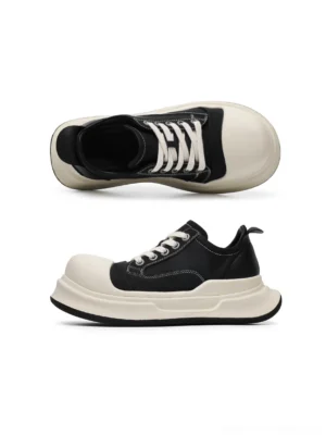Top and side flat lay view of black platform sneakers showing the oversized rounded toe, layered composite sole, off-white laces, and contrast color blocking