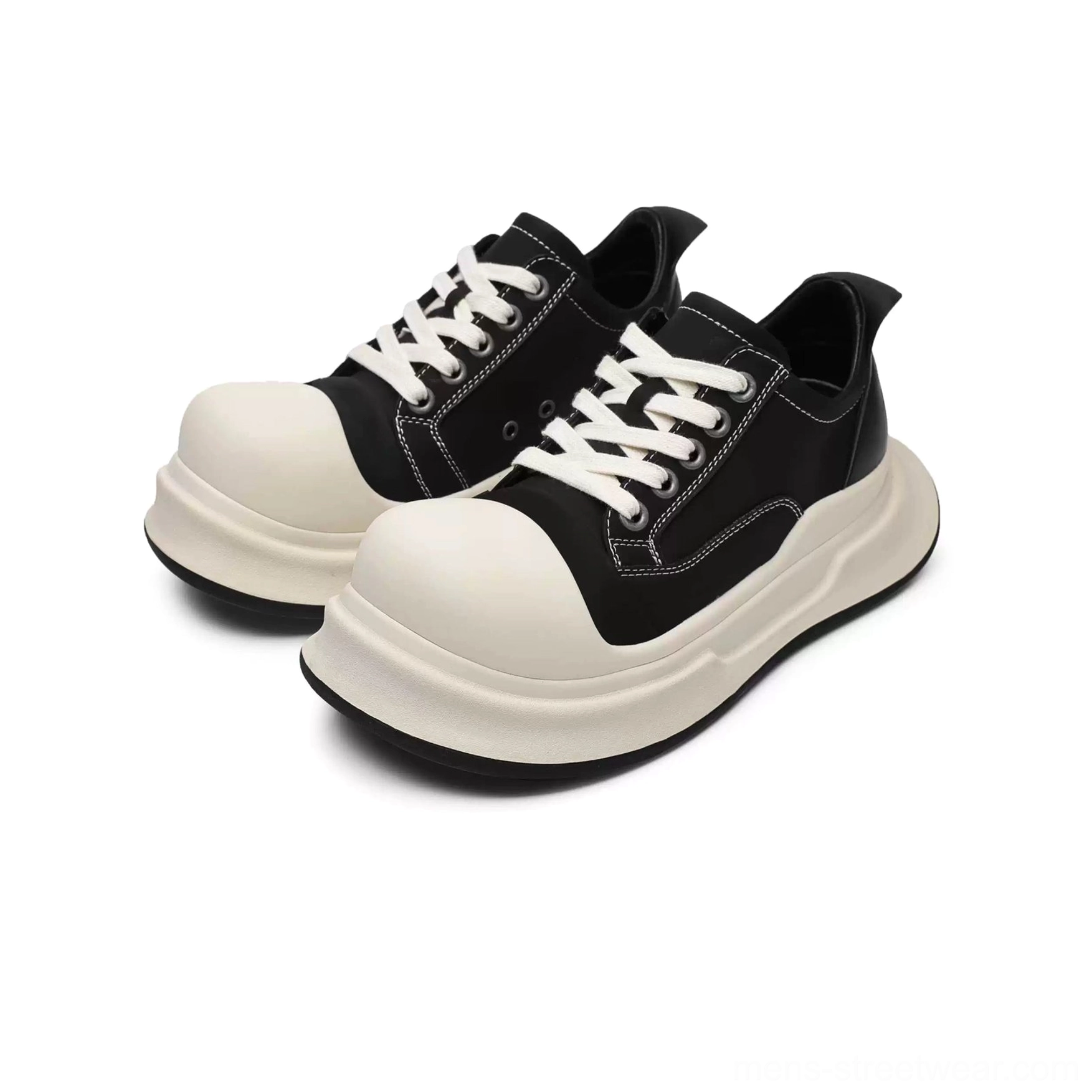 Front three-quarter flat lay of a pair of black big-head round toe platform sneakers with off-white soles, laces, toe caps, and chunky streetwear shape