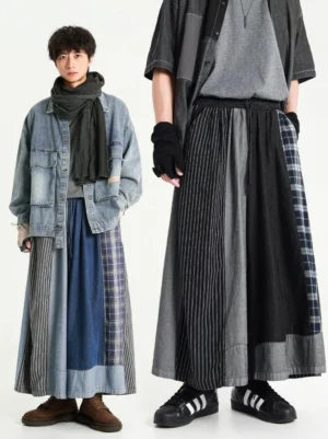 Black and blue oversized patchwork denim skirt pants shown in a two person front view, featuring loose wide-leg streetwear silhouettes