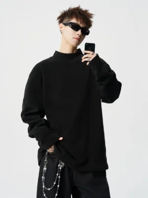 Black oversized mock neck fleece pullover top with relaxed Korean streetwear silhouette and chain detail styling