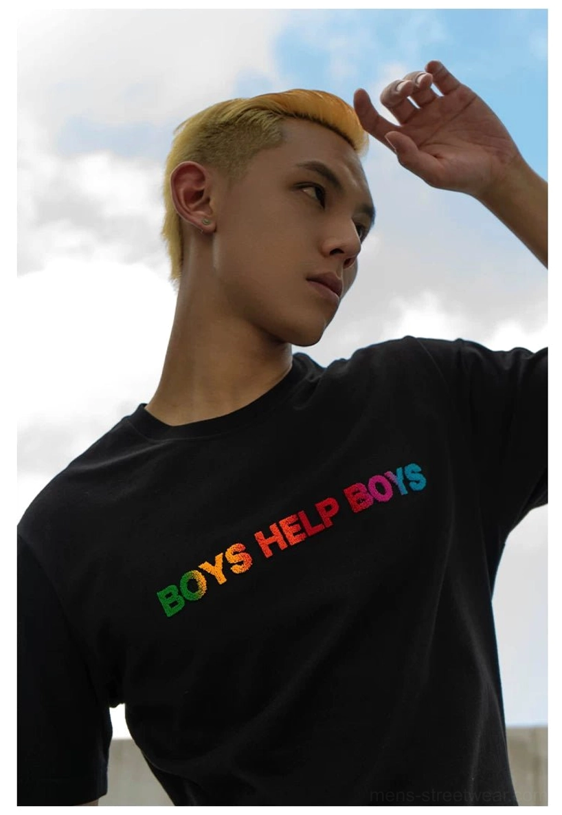 Close front view of black Boys Help Boys T-shirt with rainbow gradient lettering and relaxed classic crewneck design