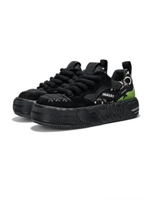 Pair of black chunky platform streetwear sneakers with camouflage heel panels and oversized flat laces