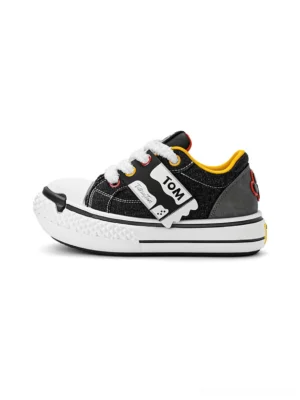 Black cartoon cat graphic chunky sole low top street sneakers with white toe cap yellow lining and adjustable strap